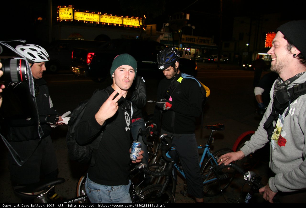 Man with a Black Hat Riding a Bicycle