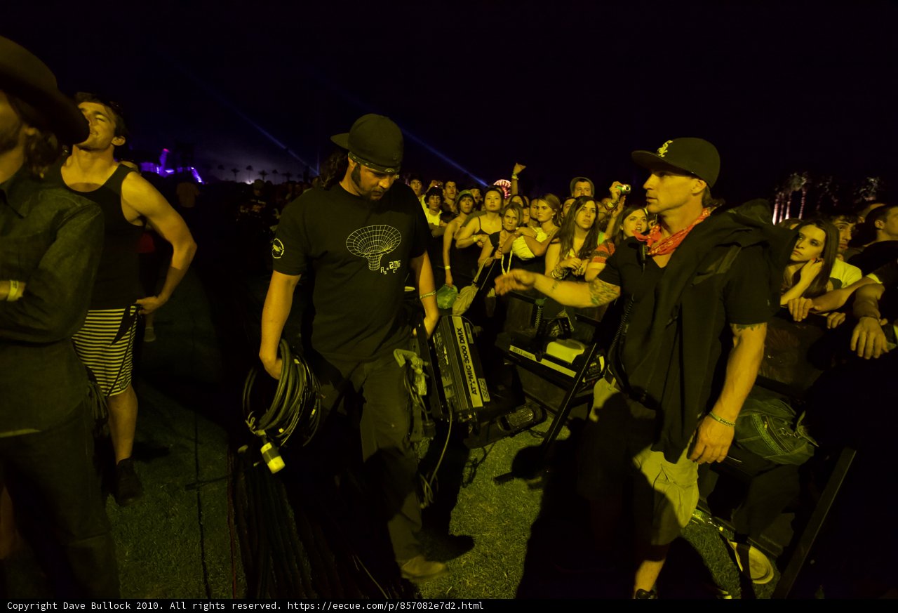Band Member and Hat-Wearing Man at Coachella Concert