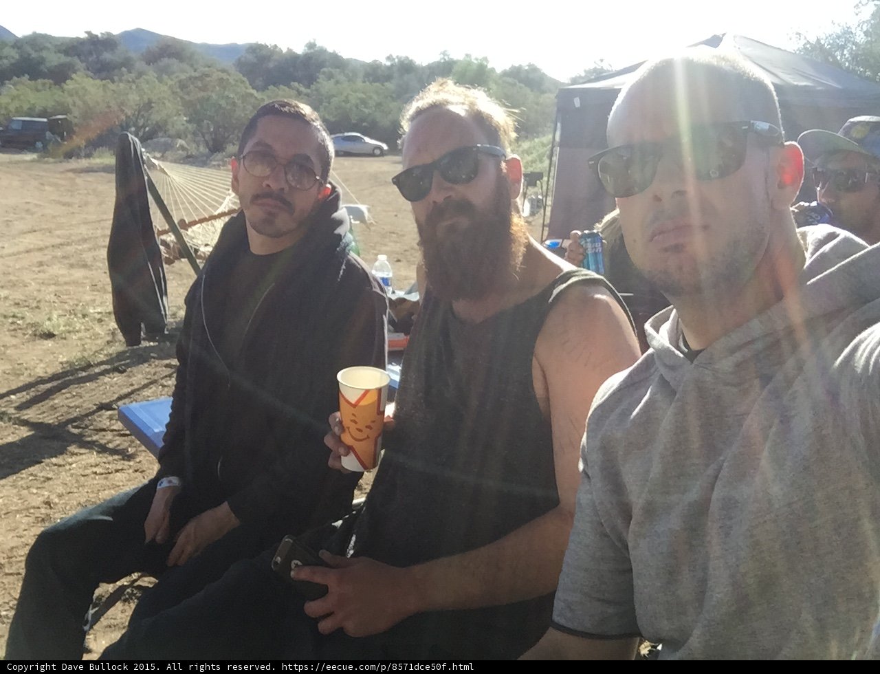 Three Men Enjoying Beers Outdoors