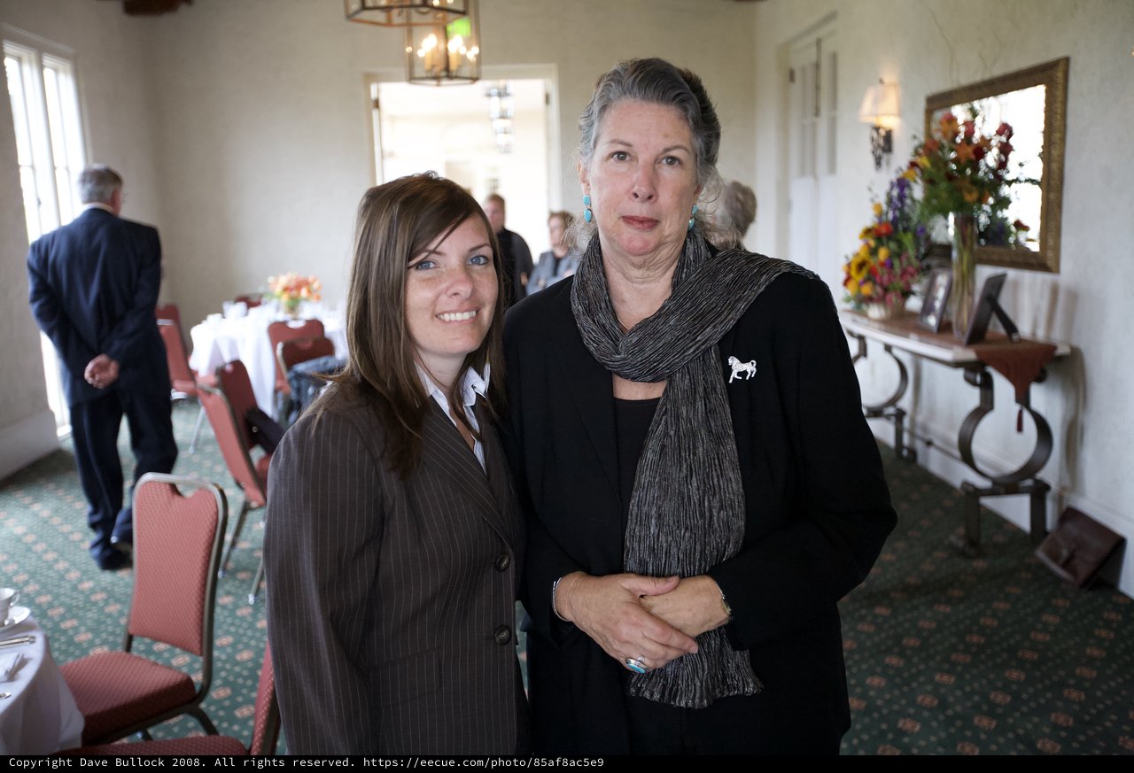 Two Women Share a Moment at Memorial Gathering