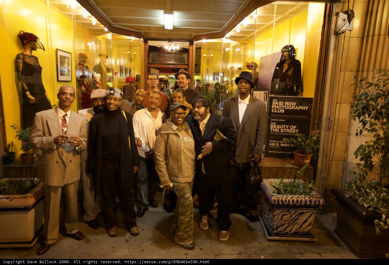 Group of people posing in front of a decorative building