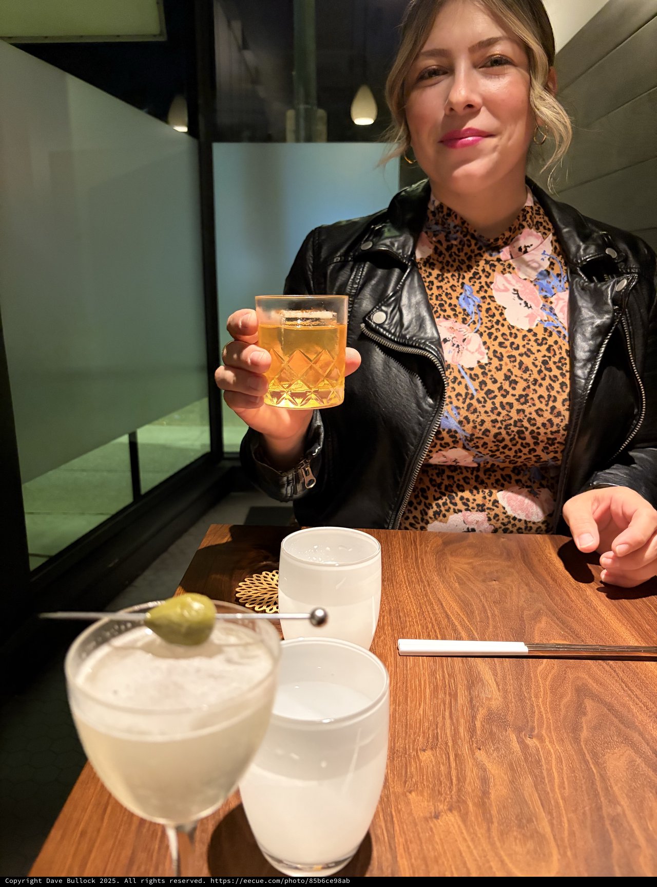 Woman Enjoying Cocktails at Modern Restaurant Bar