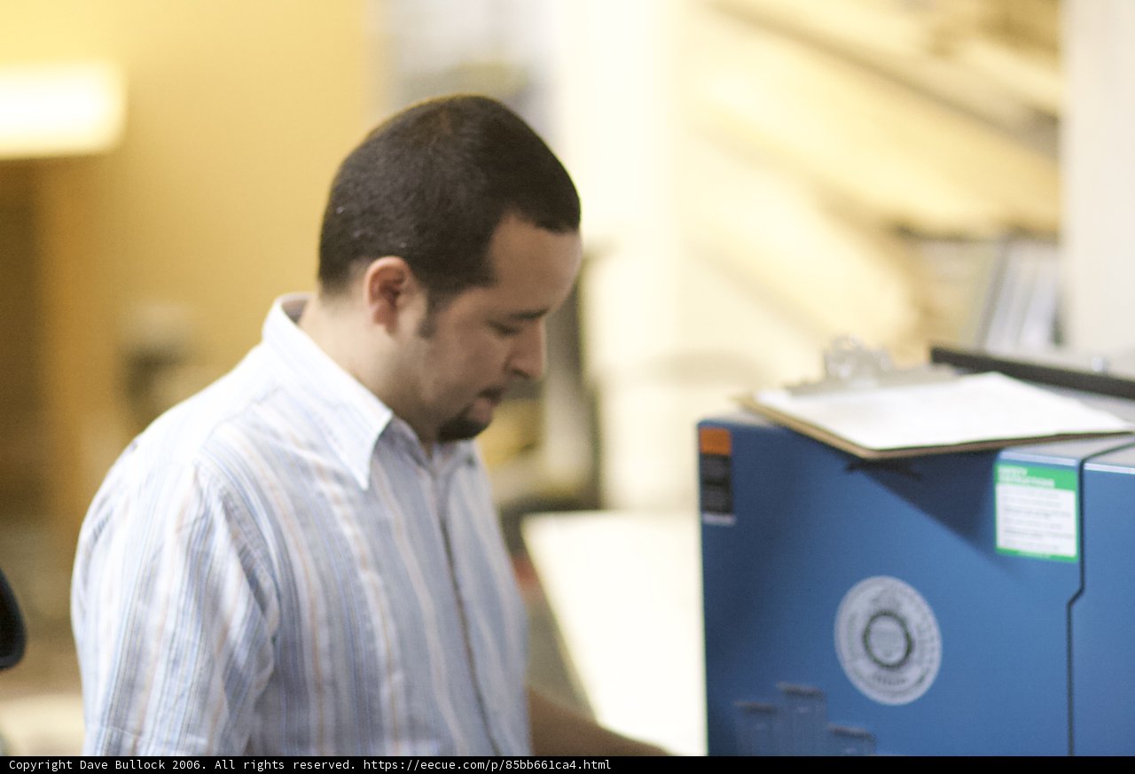 Man Examining Computer Hardware