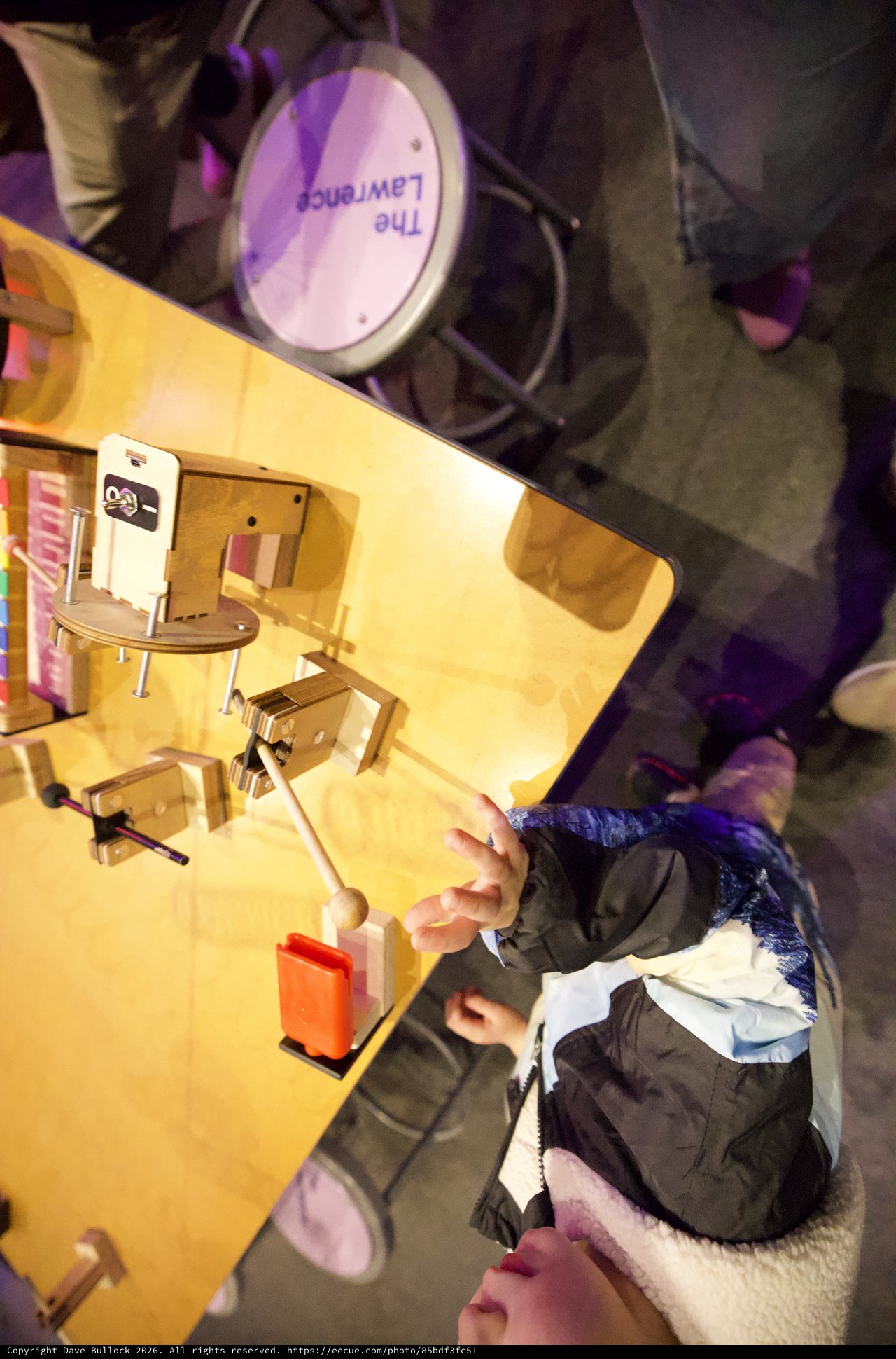 Overhead View of Young Person at Workspace with Miniature Office Setup