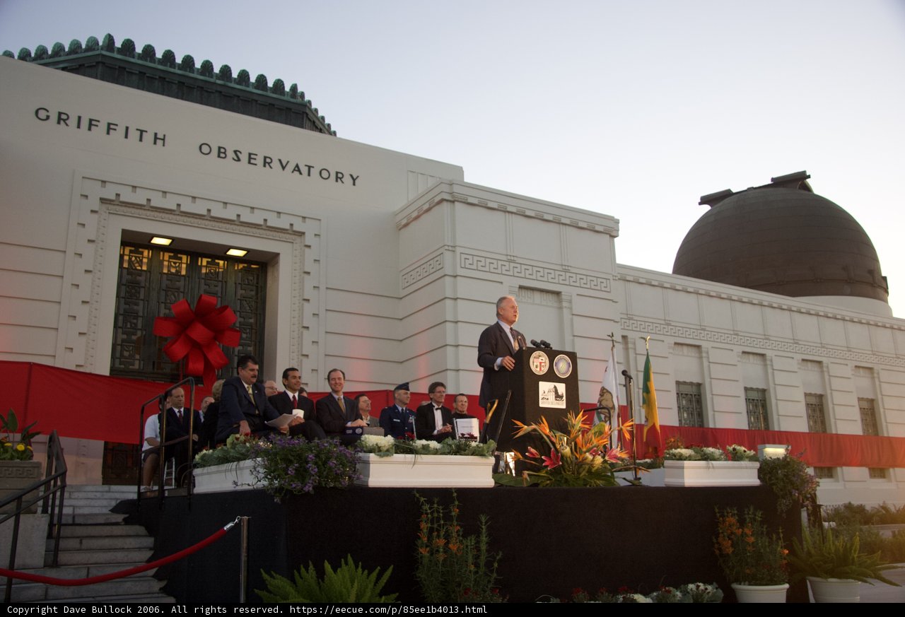 Adam Schiff and Antonio Villaraigosa speak to a crowd in front of an observatory