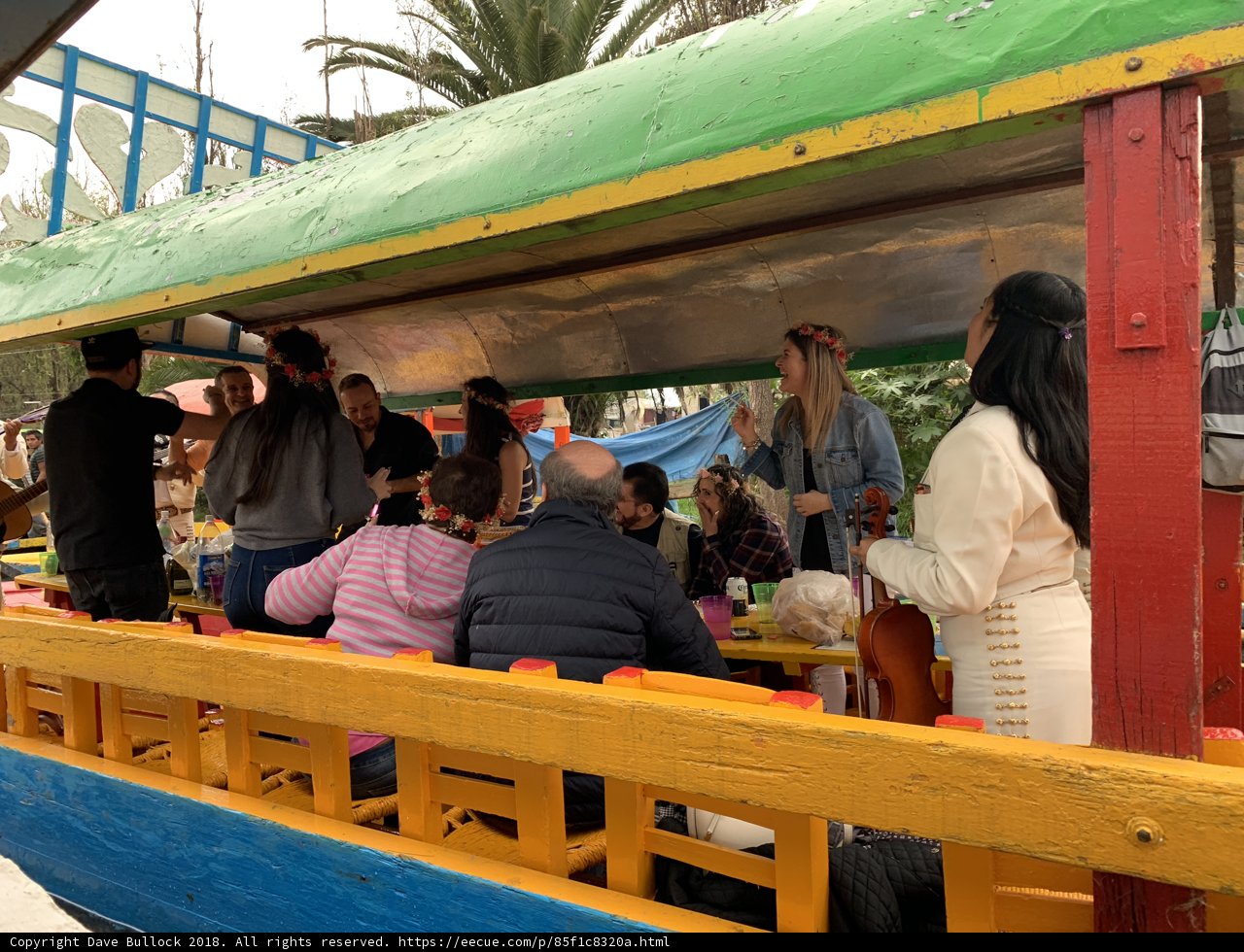 Sailing on a Colorful Canopy Boat with Friends