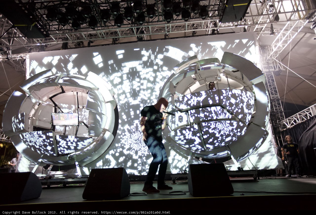 Man on stage with giant screen