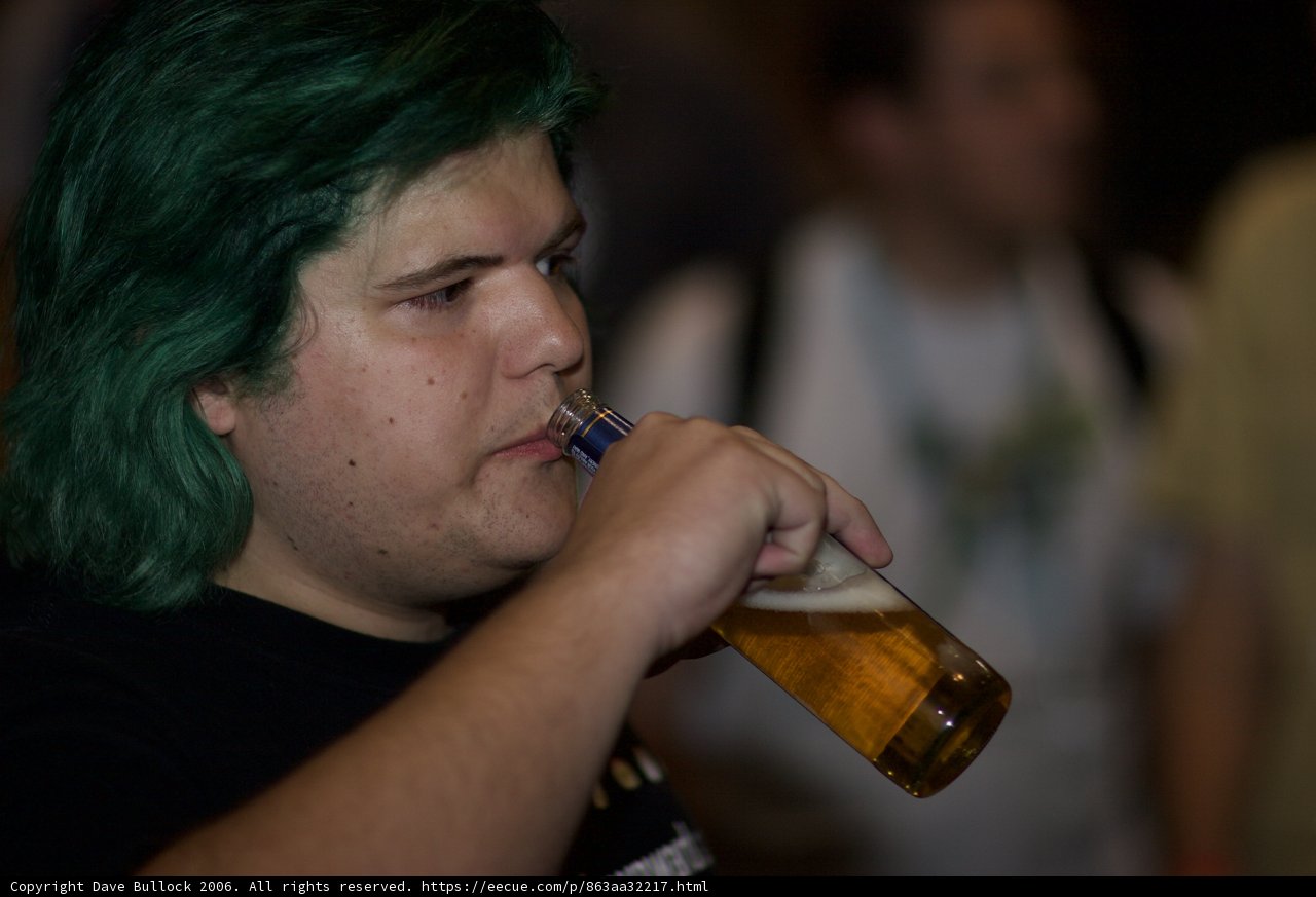Green-Haired Man Enjoying a Cold Beer