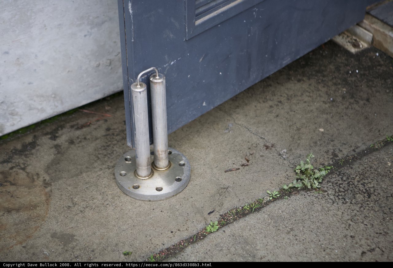 Rusty Handrail on a Corroded Door