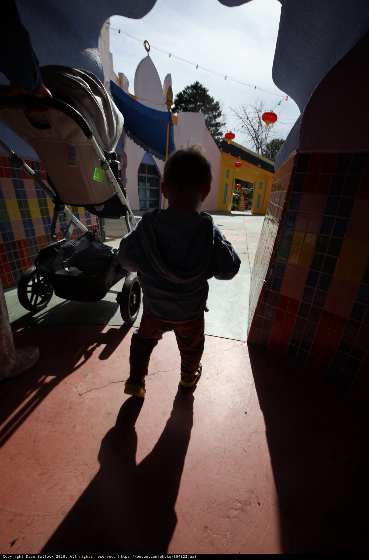 Child Explores Colorful Fantastical Village Square