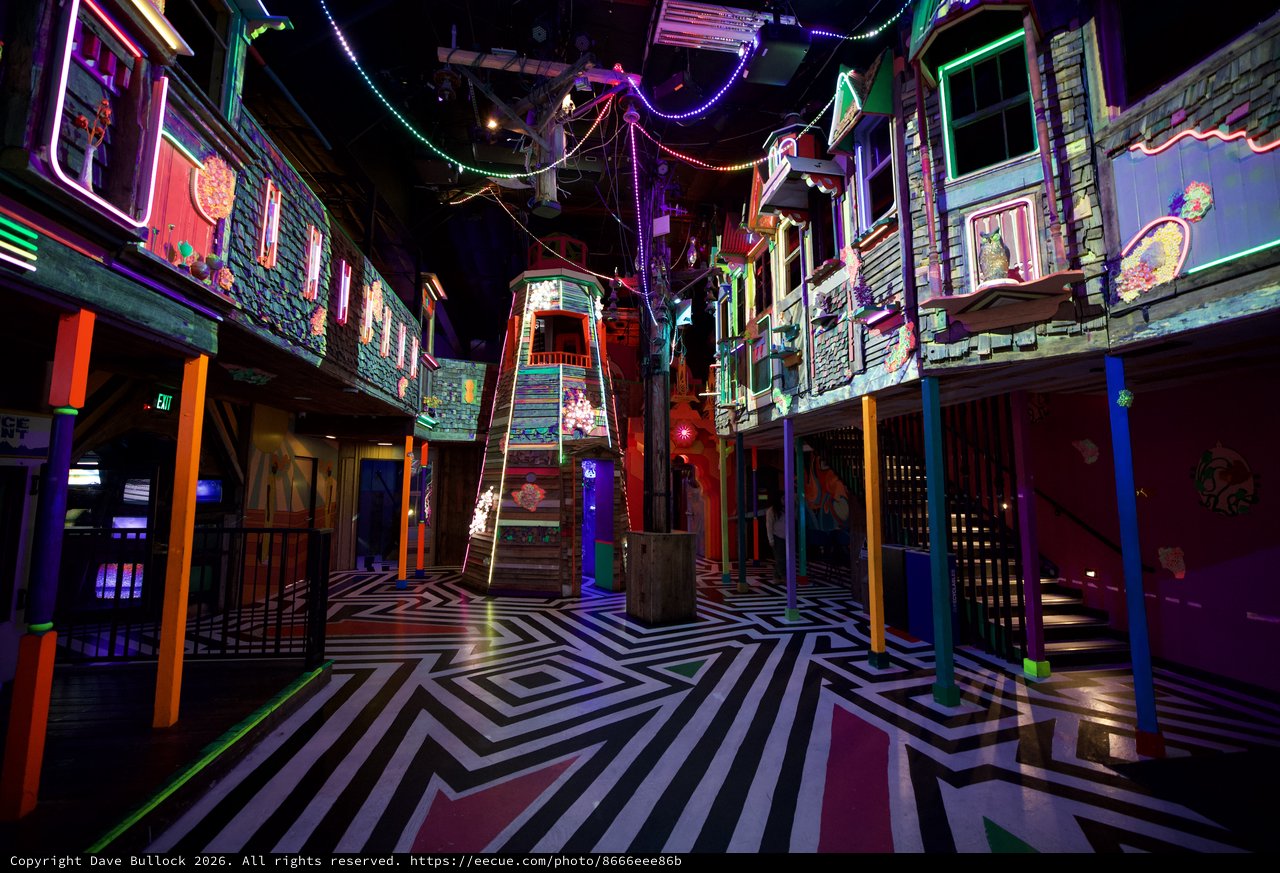 Neon-Lit Interactive Art Installation with Geometric Floor