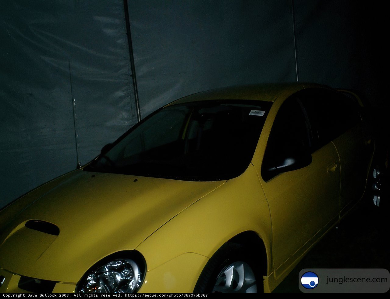 Yellow Sports Car in the Dark Room