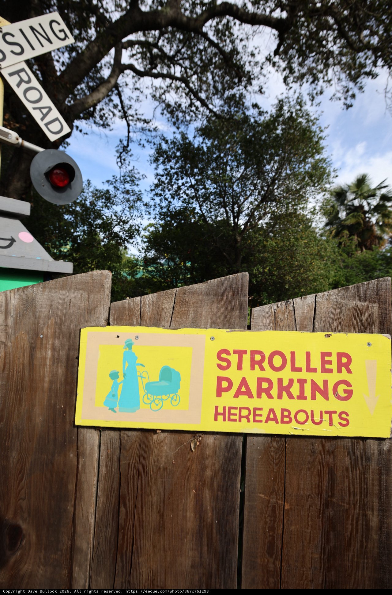 Vintage Stroller Parking Sign at Railroad Crossing