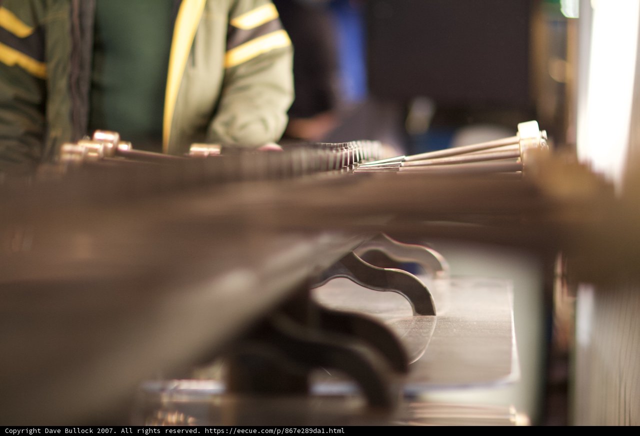 Factory Worker Operating Machinery