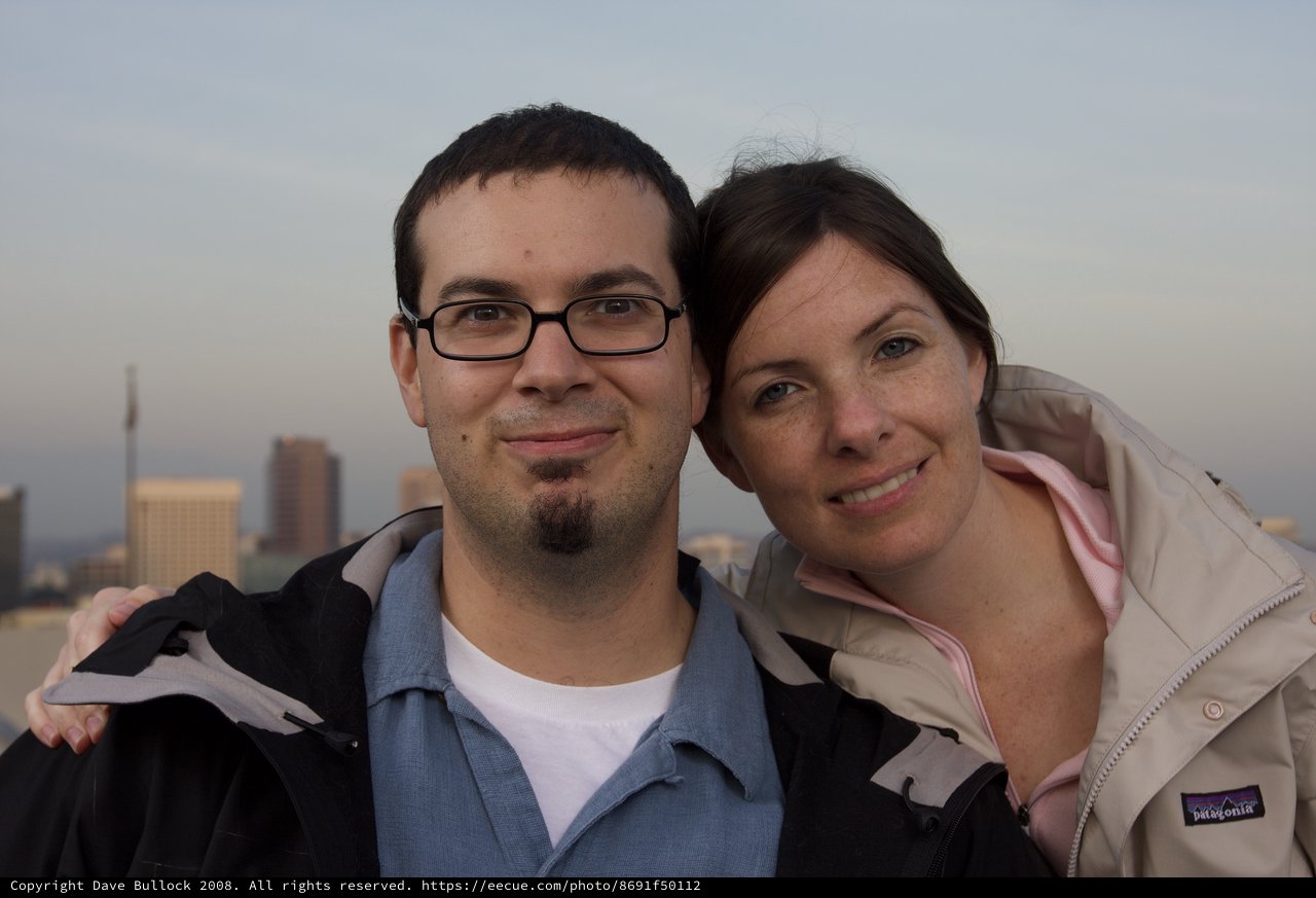 Couple Smiling Together Against City Skyline