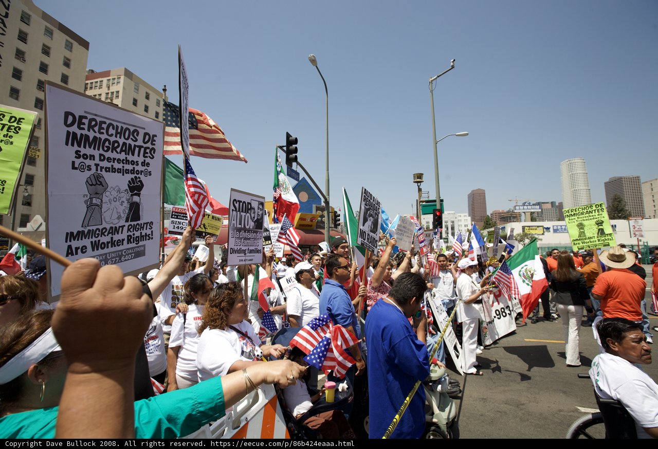 Mayday Protesters Take to the Streets with Signs and Flags