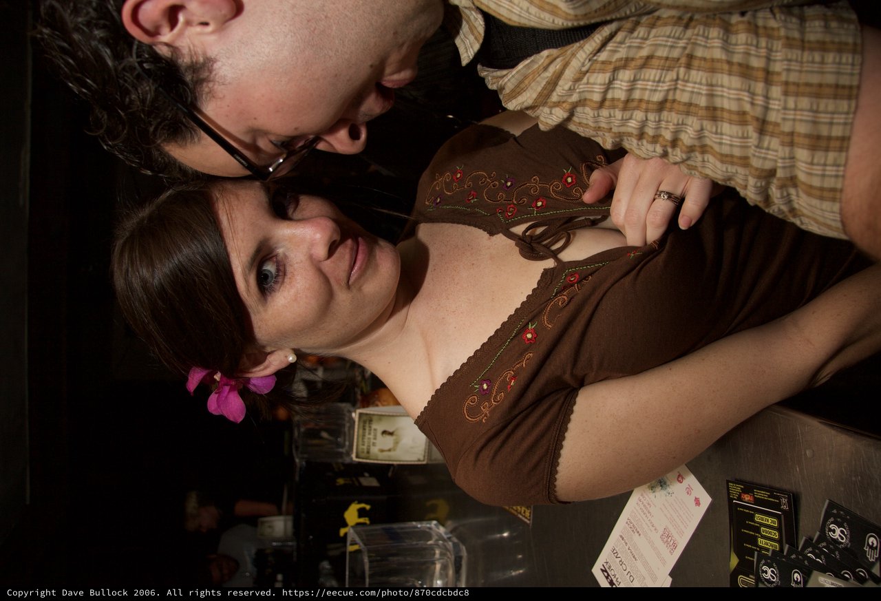 Couple Sharing Intimate Moment at Night Venue