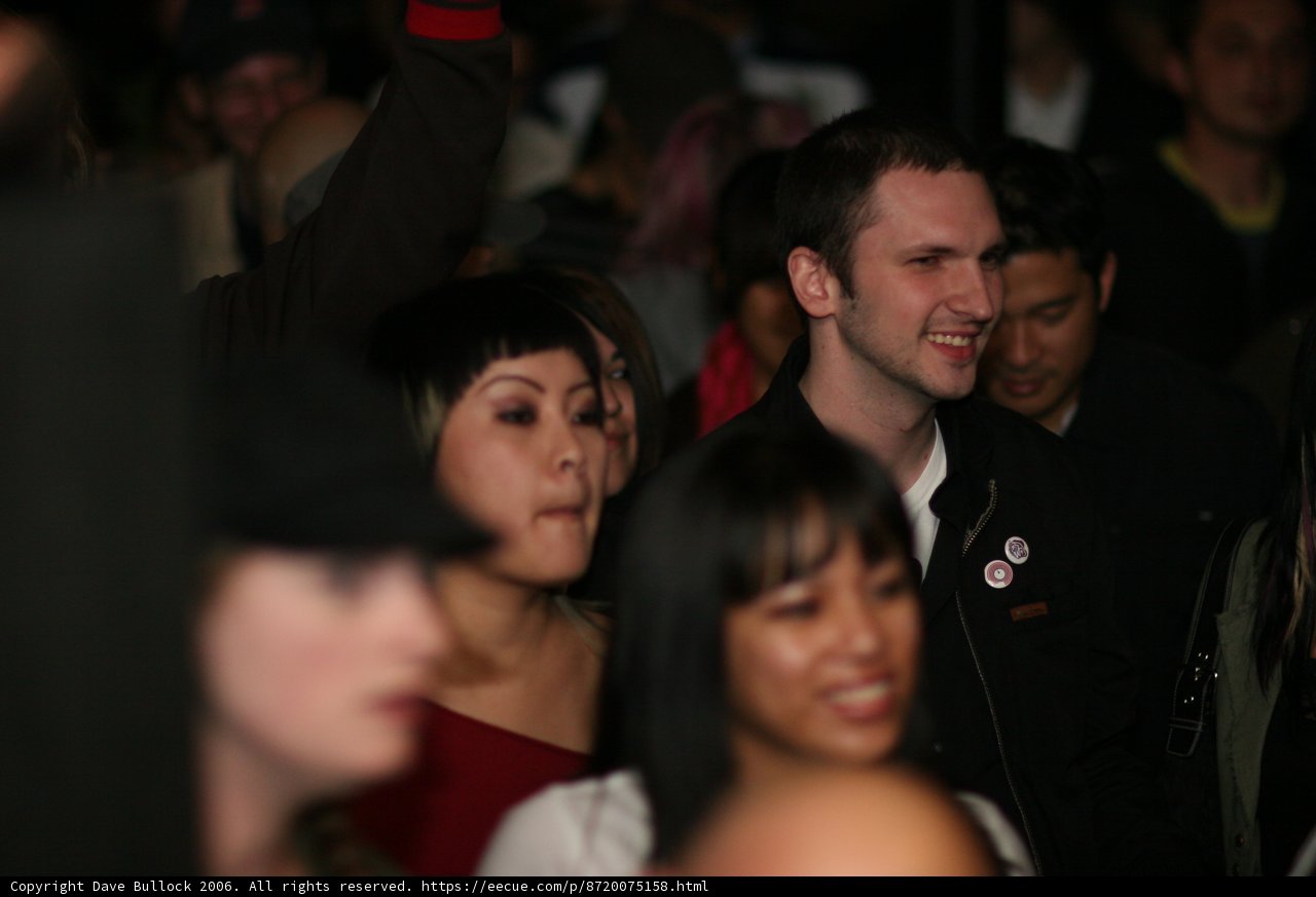 A Smiling Man in a Sea of People