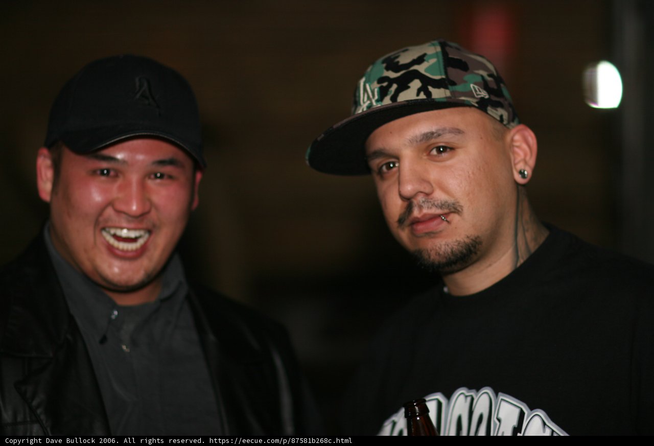 Smiling Duo in Baseball Caps