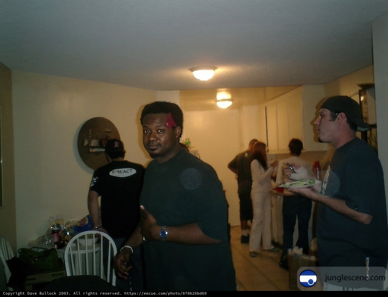 Man in Black Shirt at Dining Table