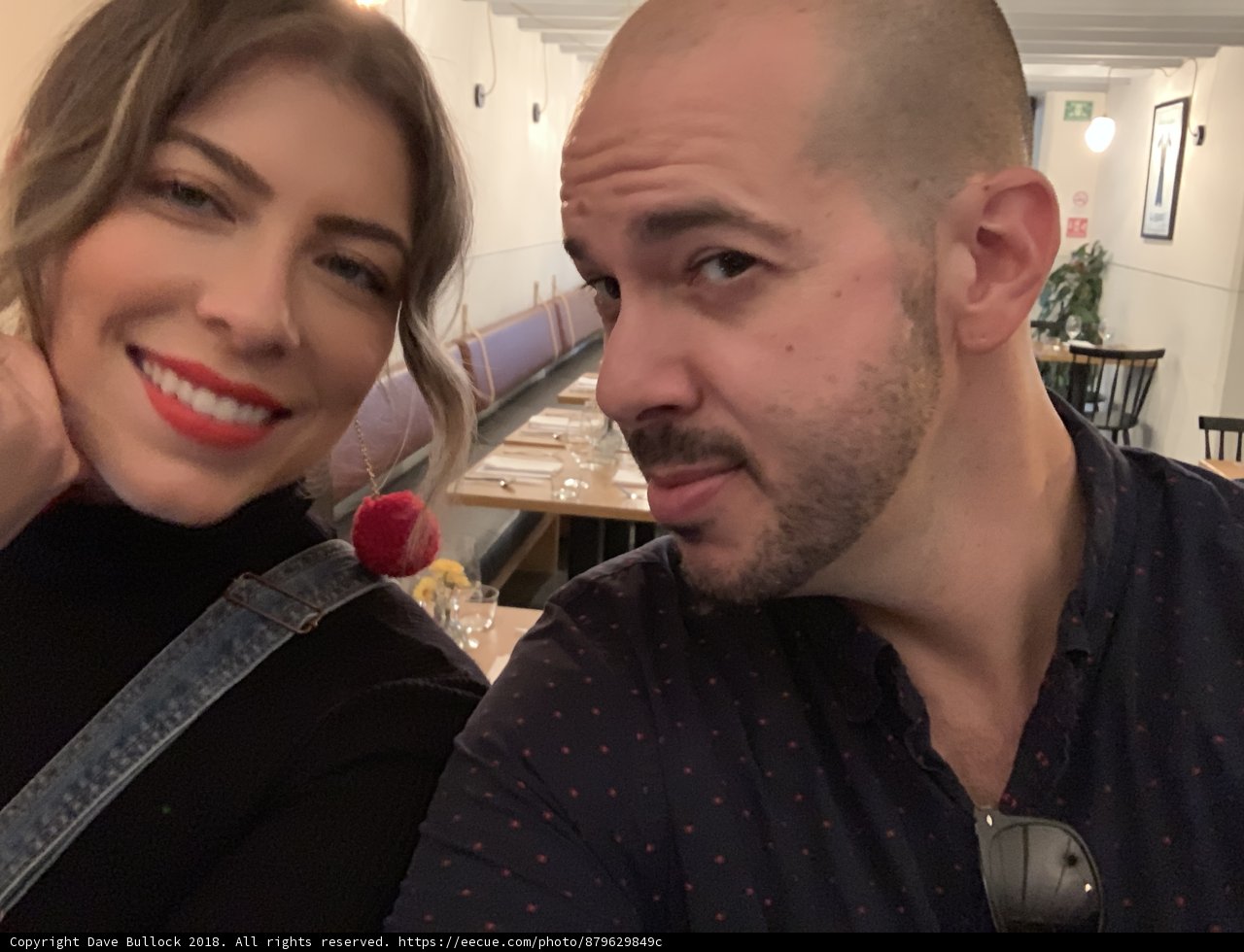 Happy Couple Captures Perfect Moment at Restaurant