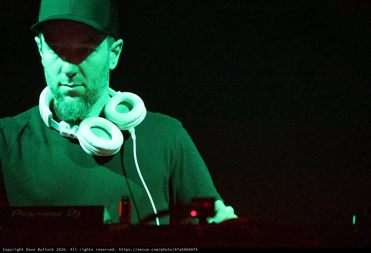 DJ Lost in the Mix Under Green Stage Light