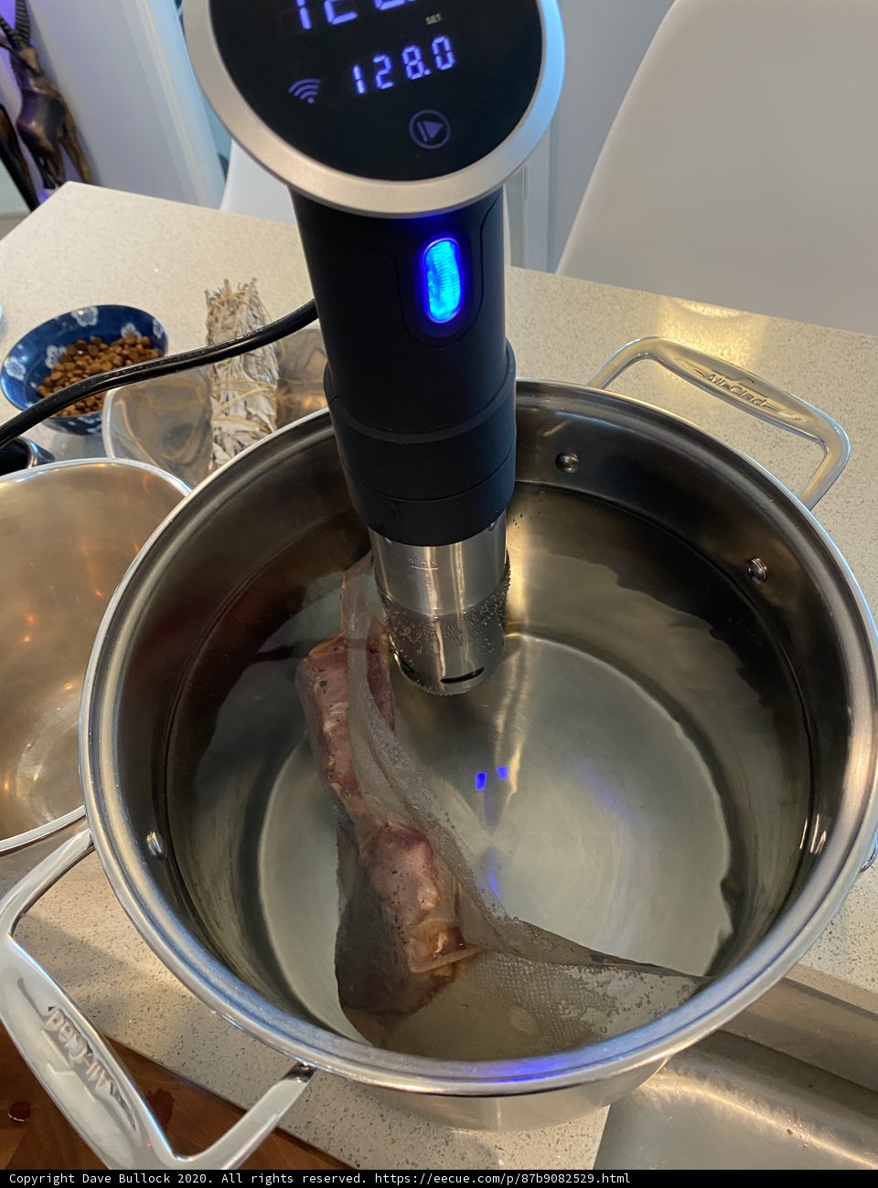 Taking the Heat: Checking Temperature of Mutton in Pan