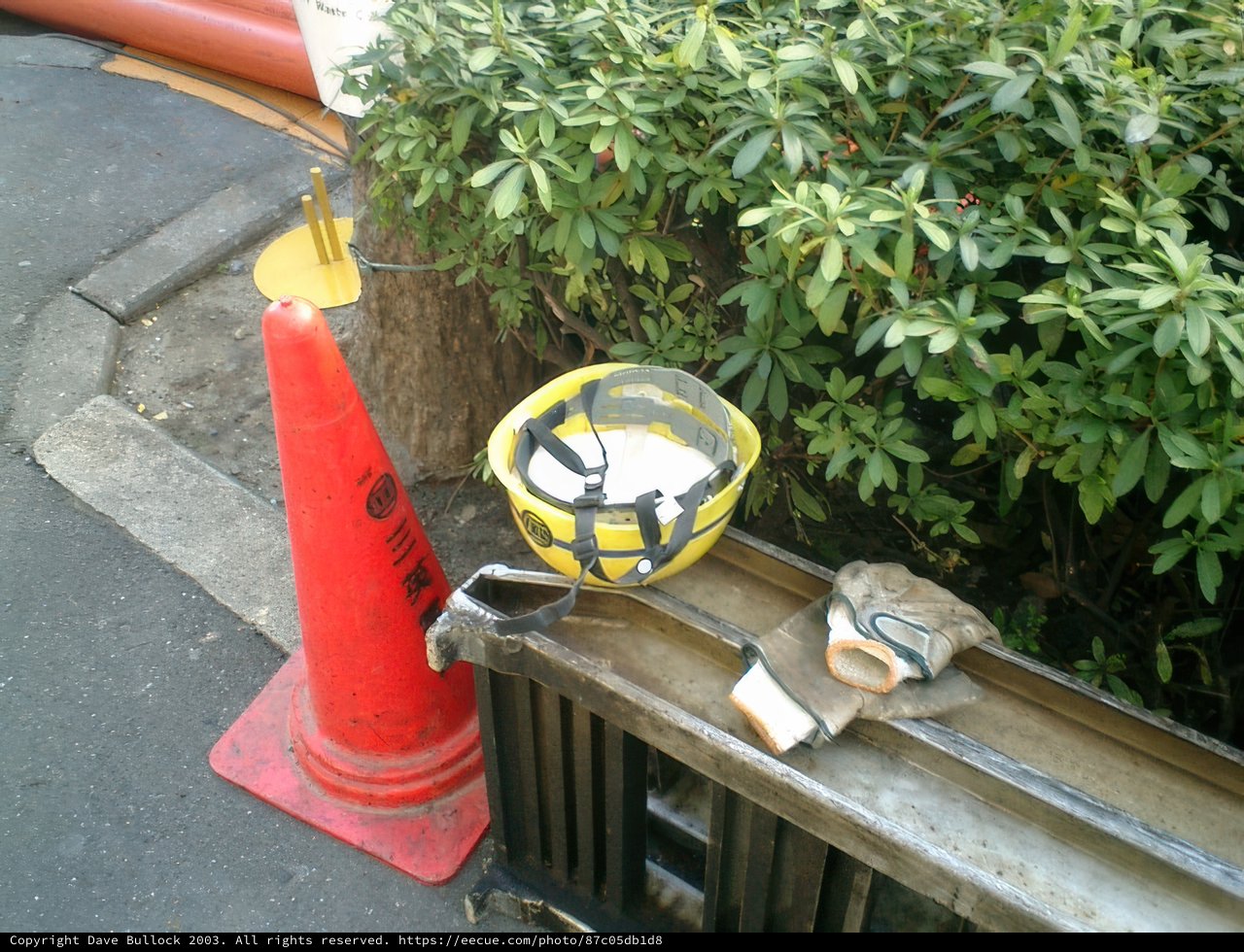 Yellow Hardhat on City Ledge