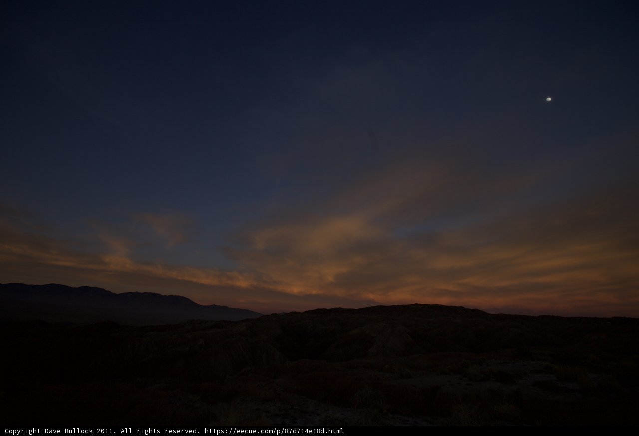 Desert Sunset with Moon and Sun