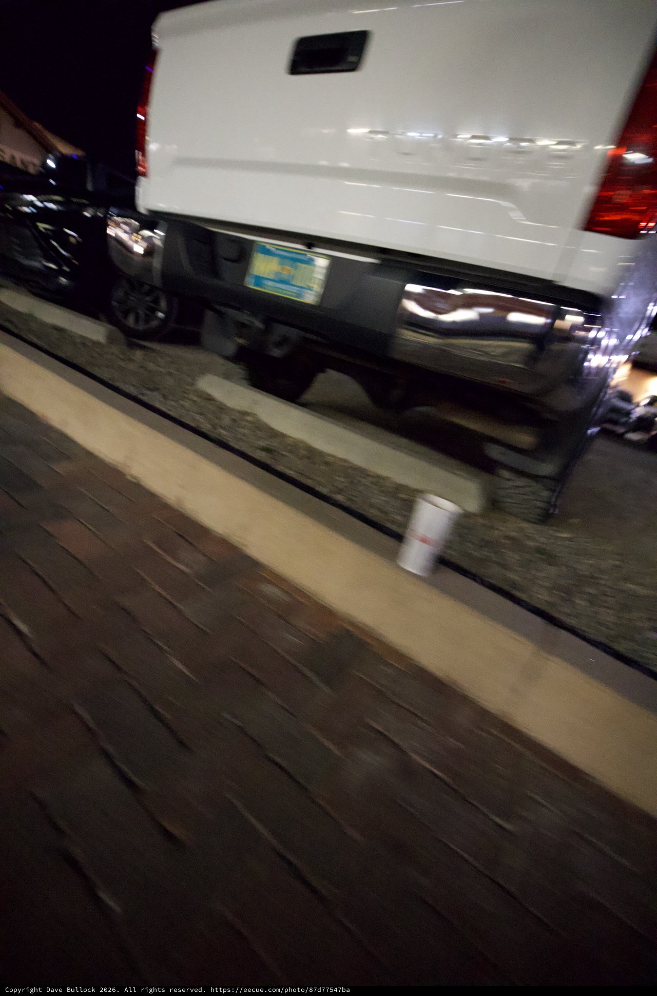 White Van Parked on Santa Fe Boardwalk at Night