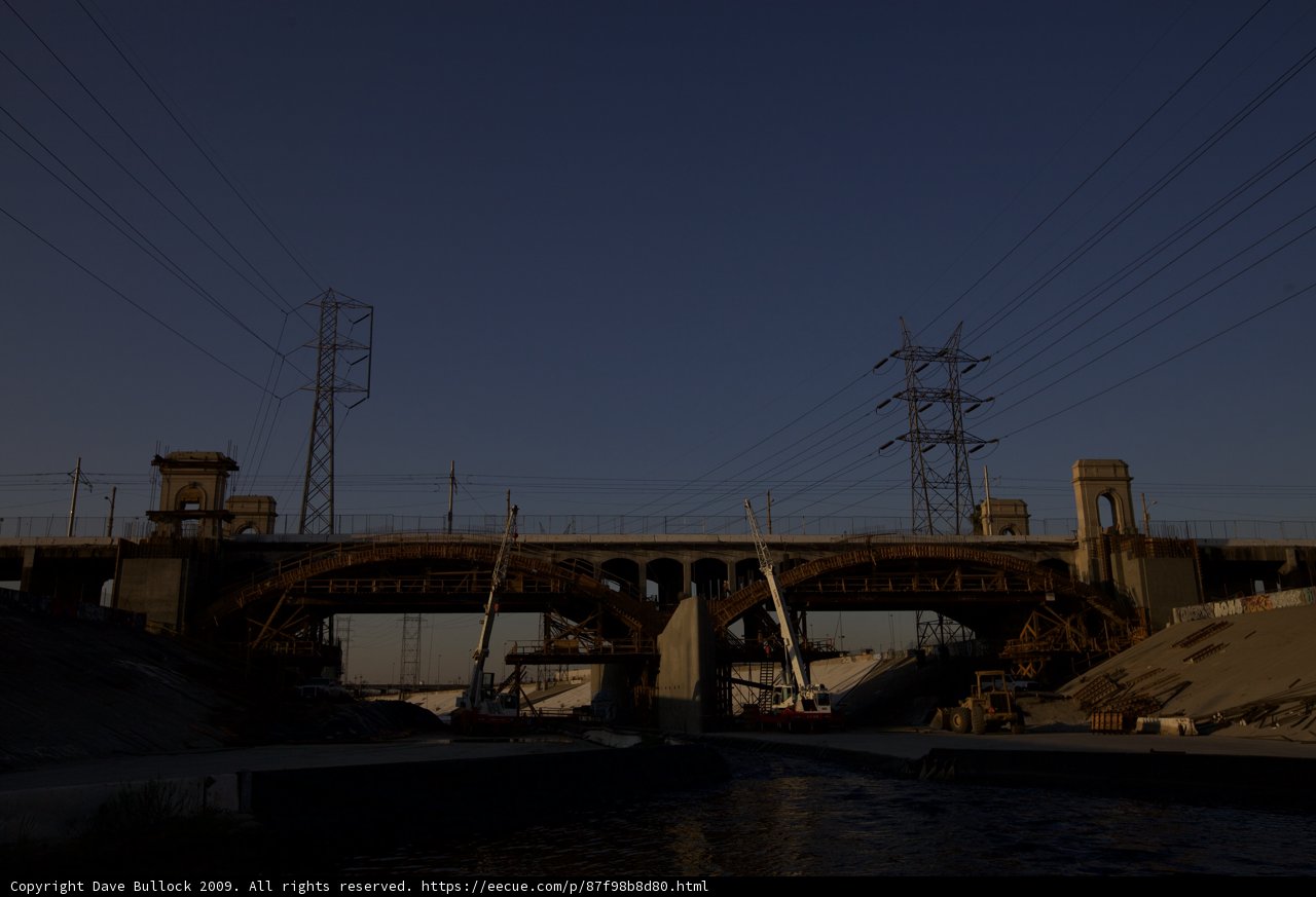 Freeway Overpass Bridge with Power Lines and Boat