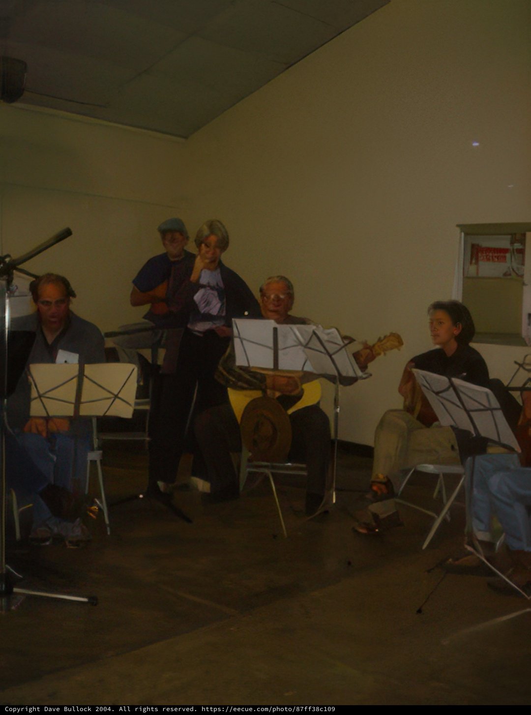 Group Performance of Musicians Playing Instruments on Chairs