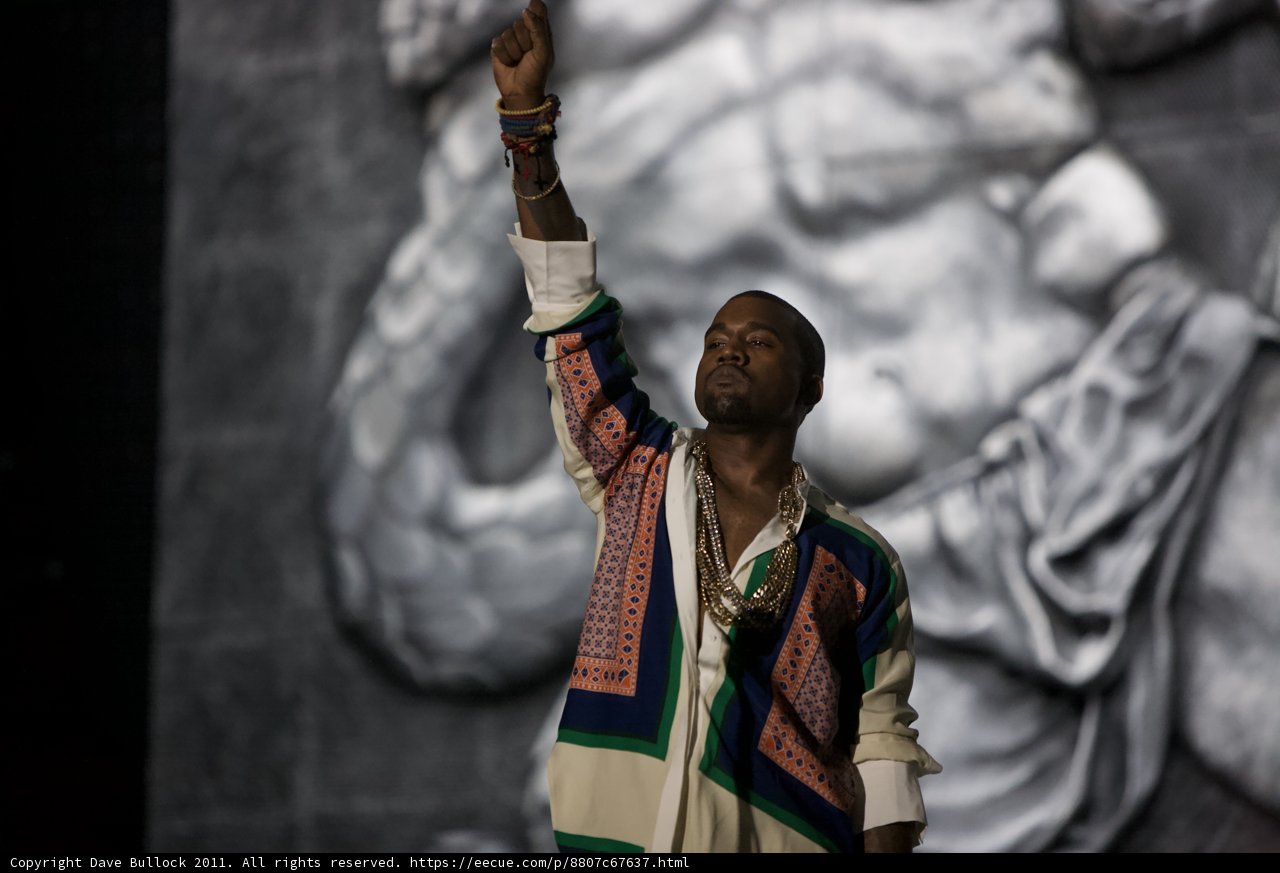 Triumphant Kanye Raises His Hand in Victory