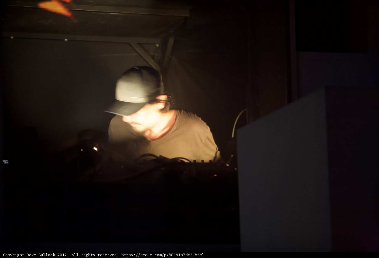 Hat-wearing DJ in the Dark