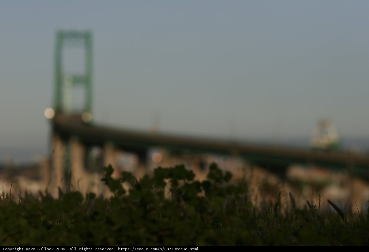 Blurry Urban Bridge with Green Handrail
