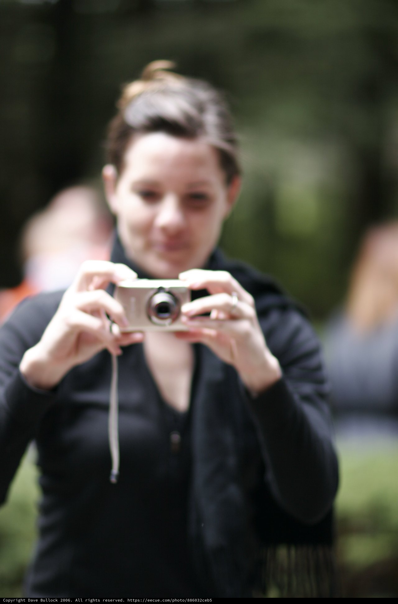 Woman Captures a Moment with Compact Camera