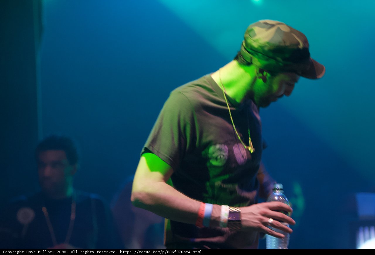 The Hat Man with a Water Bottle at the Concert