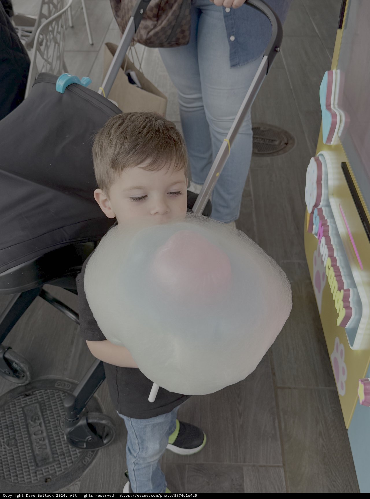 Young Boy Enjoying Cotton Candy Treat