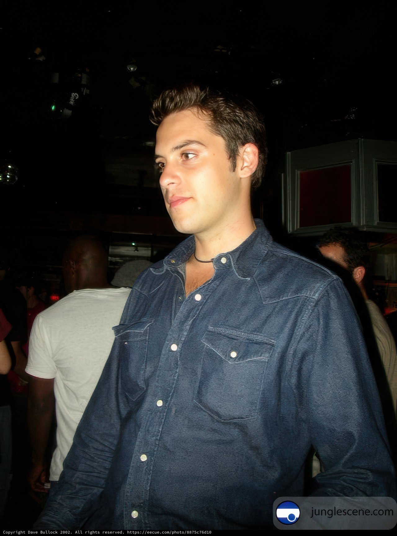 Blue Shirted Man at the Night Club