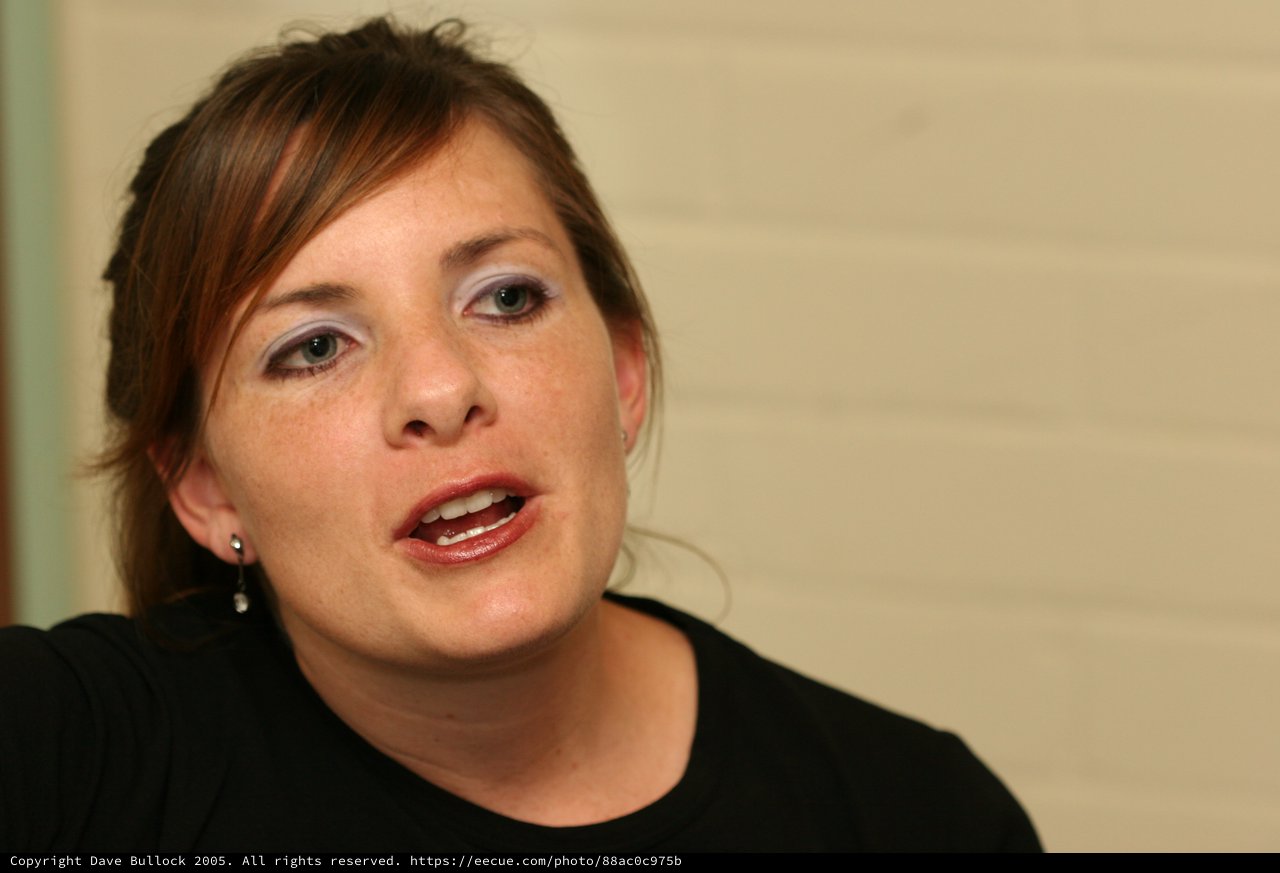 Engaged Woman Speaking Candidly in Indoor Setting