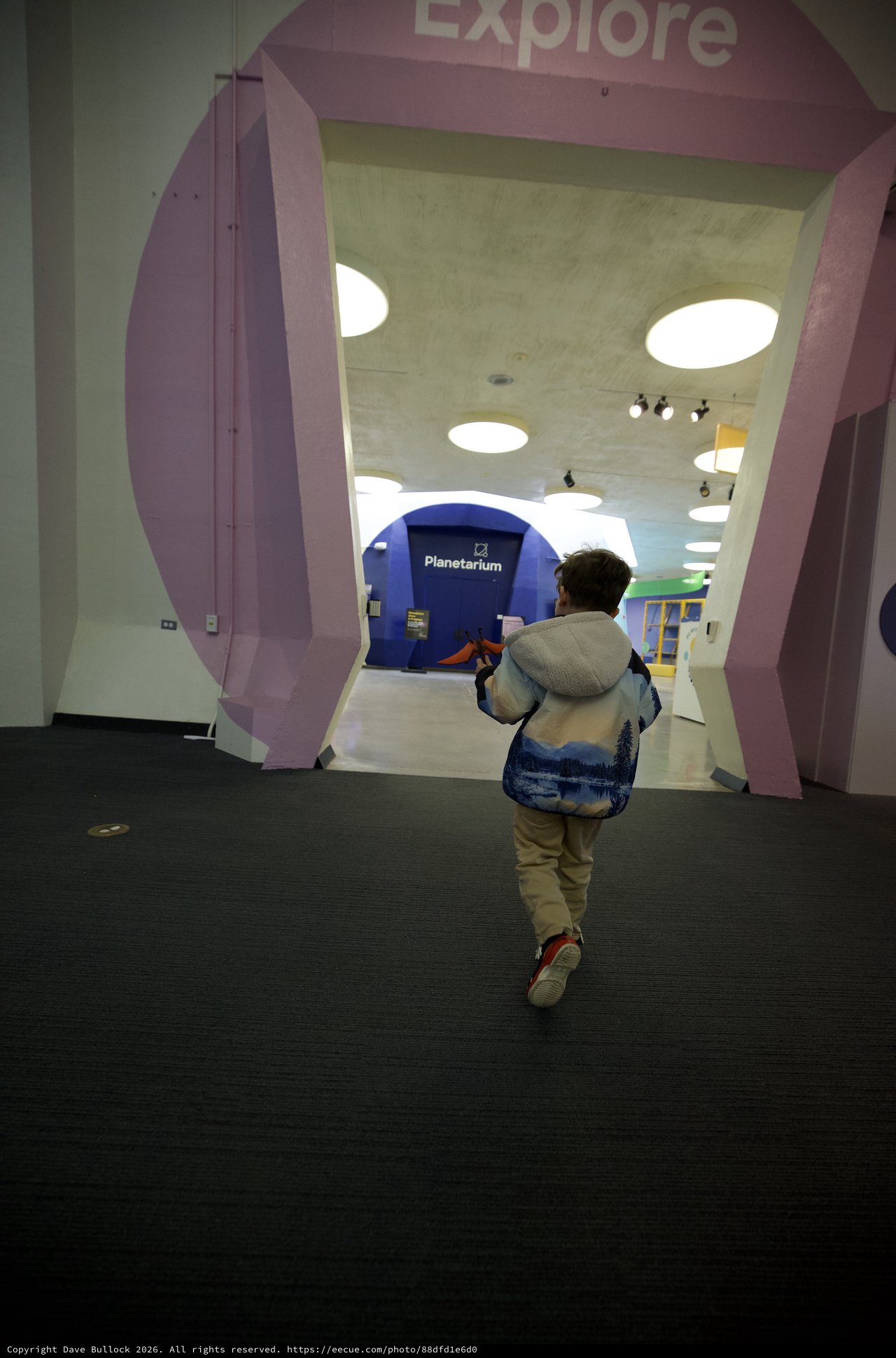 Child Running Through Museum Exploration Entrance
