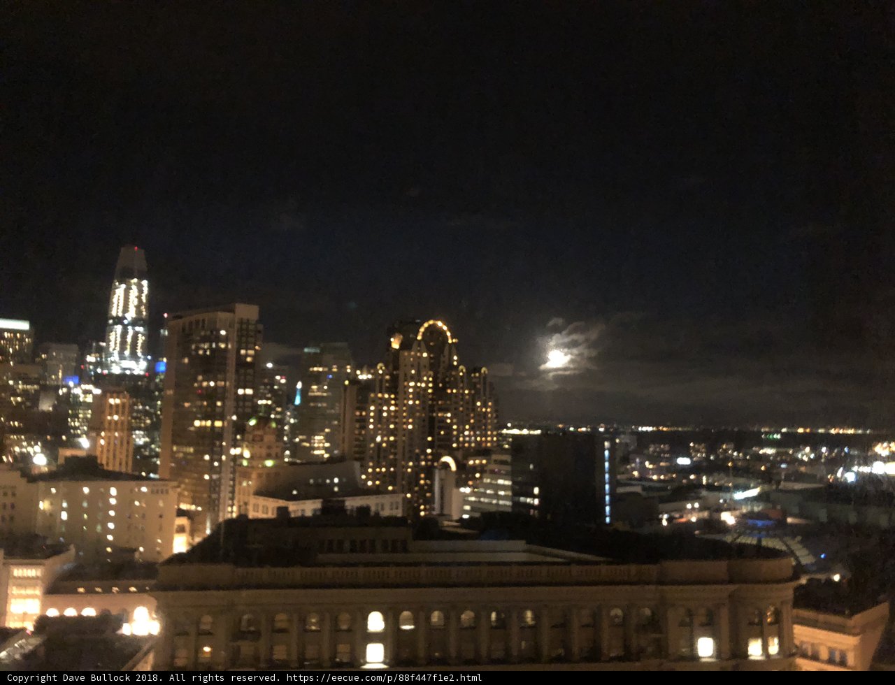 City Skyscrapers Illuminate Under Moonlight
