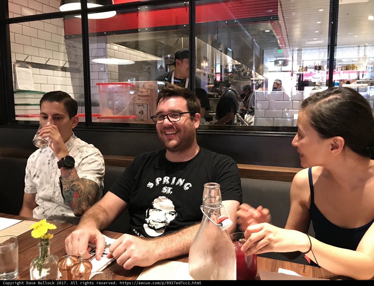 Friends Enjoying Wine in a Cozy Restaurant