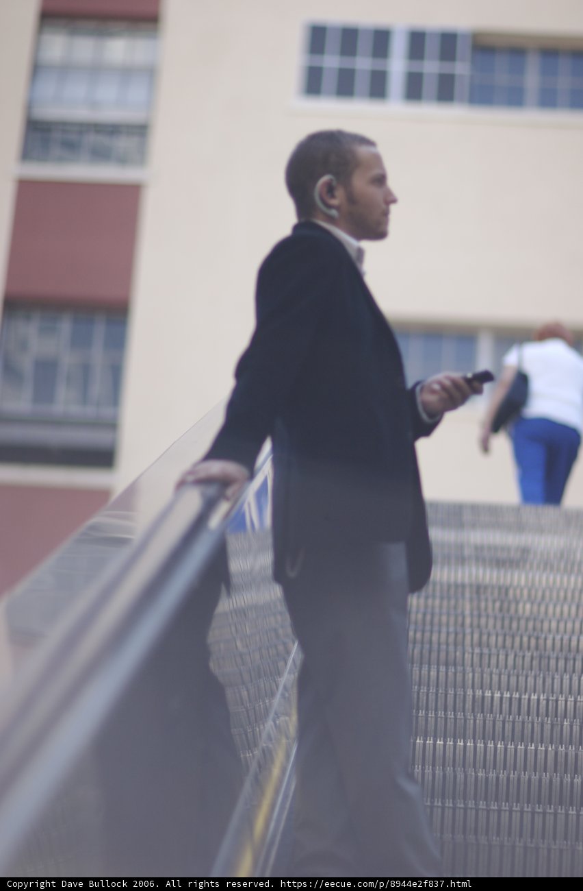 Formal Attire on the Escalator