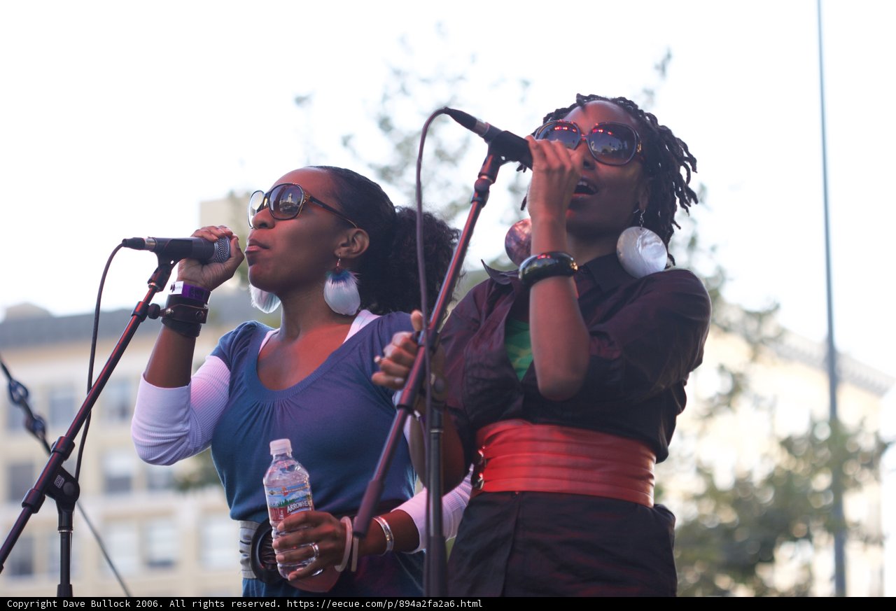 Two Women Singing Their Hearts Out
