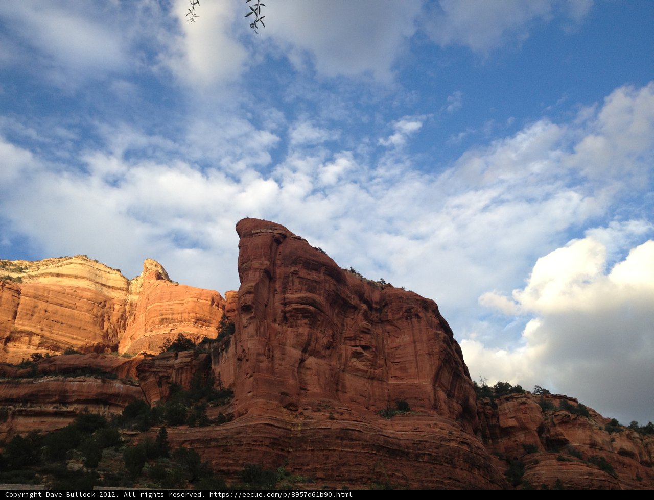 Majestic Red Rock Formation and Cloudy Skies