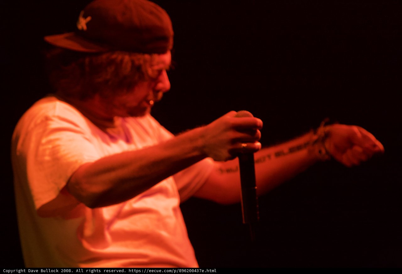 Hat-wearing Man with Microphone