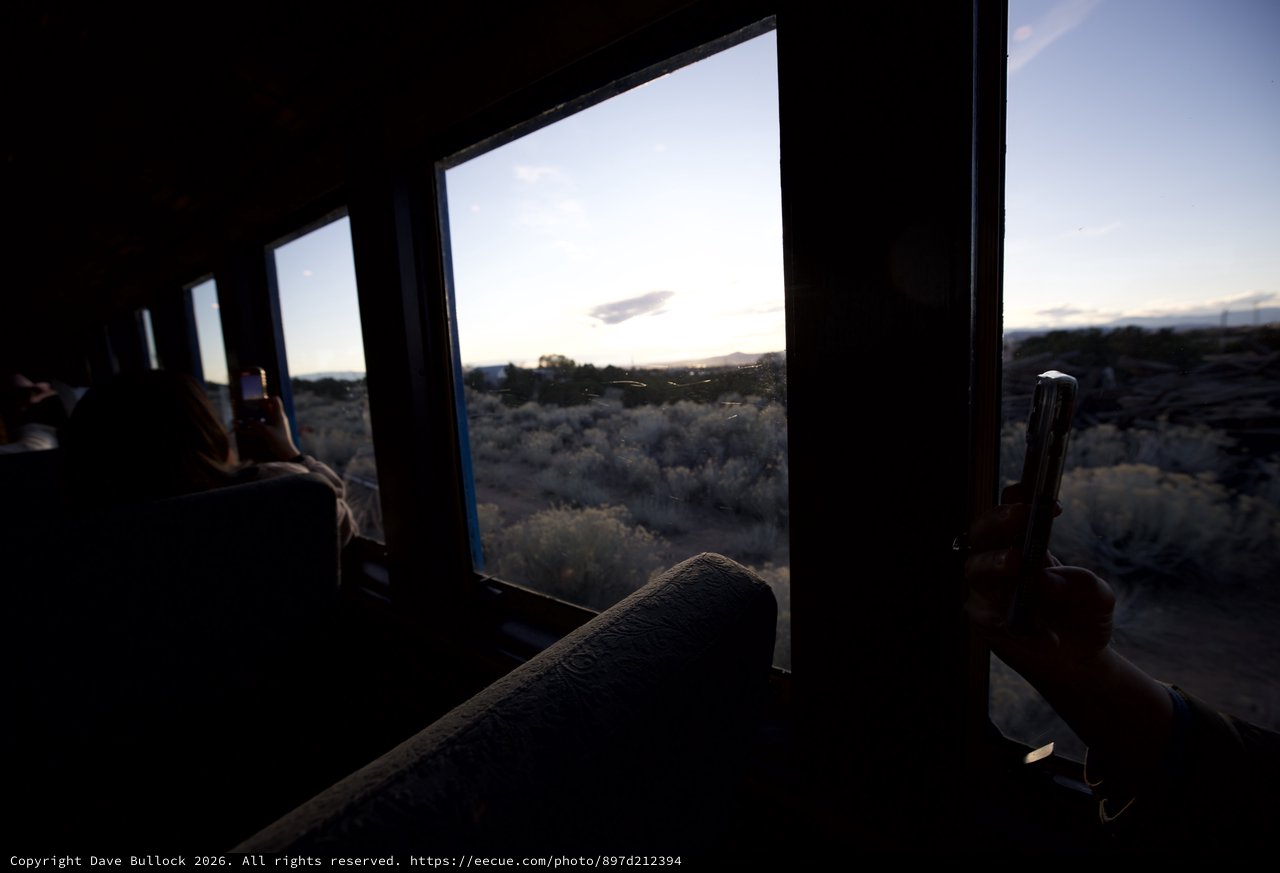 Desert Sunset View Through Train Window at Dusk