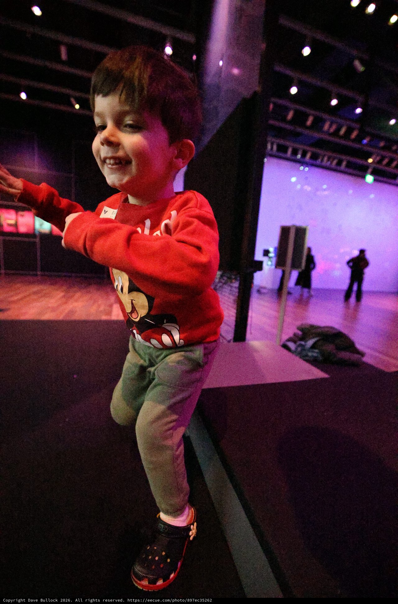 Young Boy Dancing Joyfully at Baby Rave Event