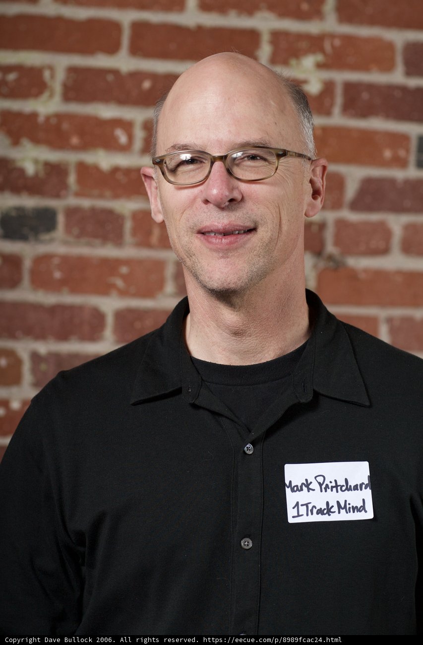Smiling Bald Man in Glasses